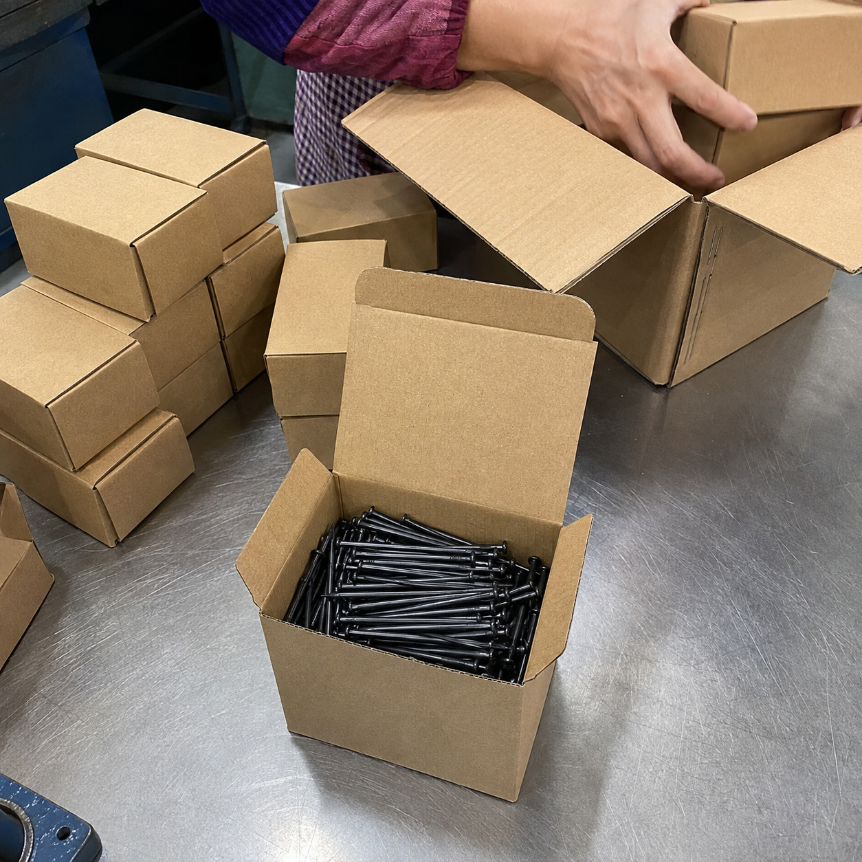 Black concrete nails packed in small boxes