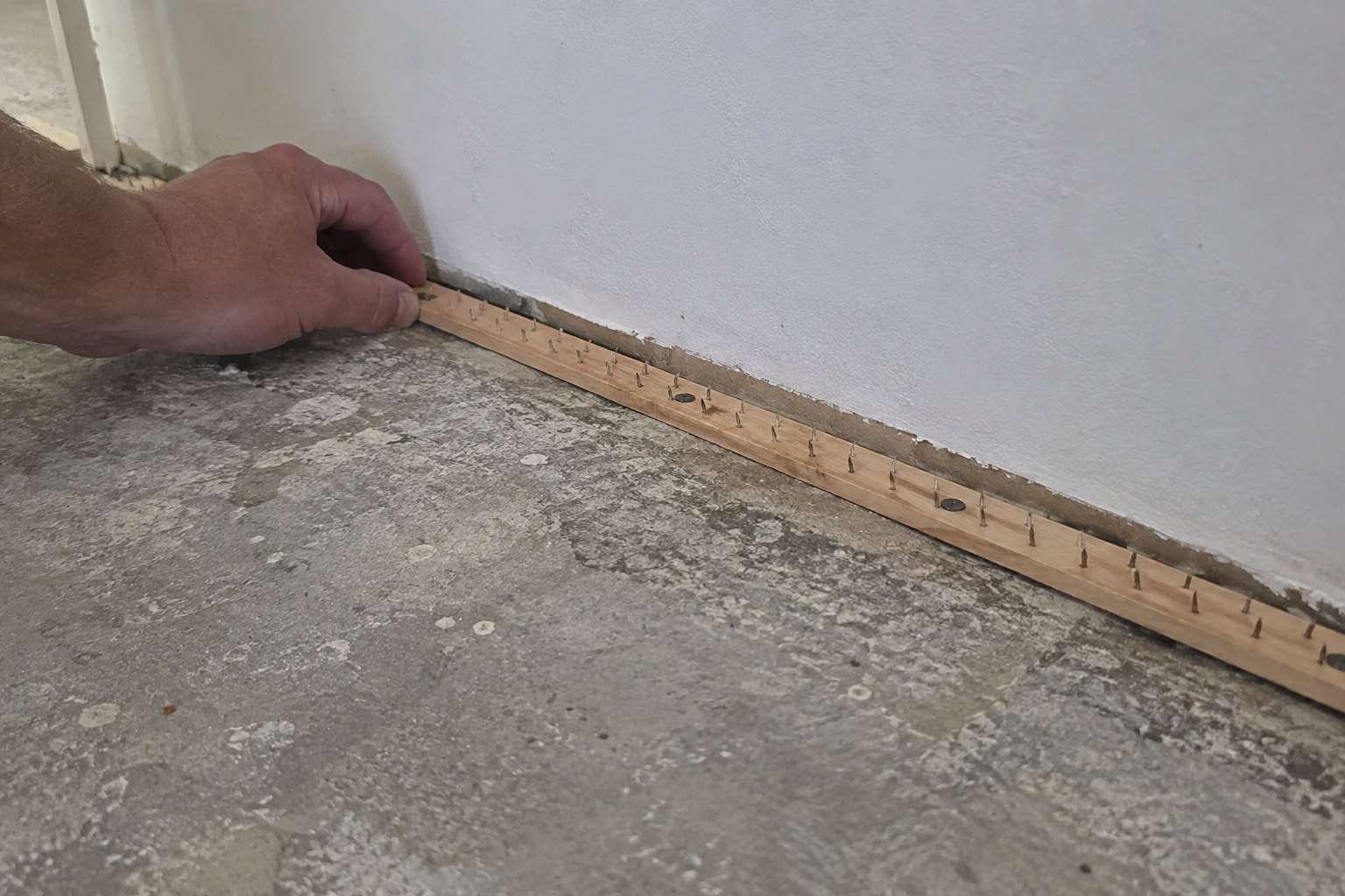 Concrete tack strips with hardened steel pins tack strips for concrete subfloor installation