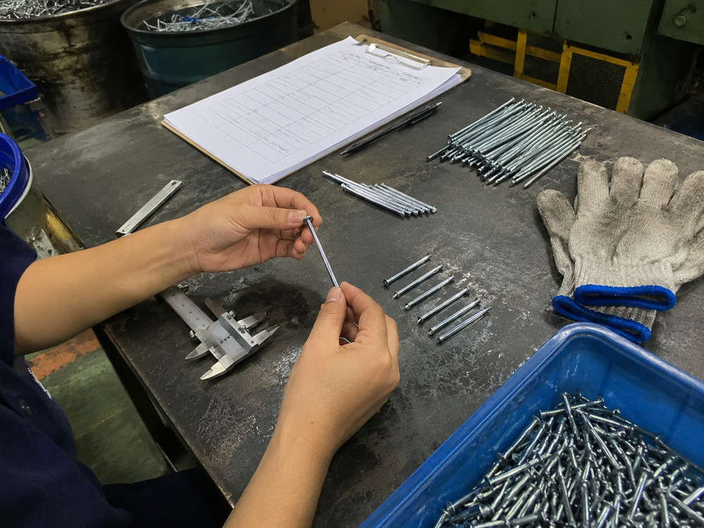 Buyer checking concrete nail specifications for masonry construction